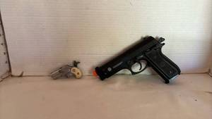 lot 1058 image: Taurus Cybergun 6mm Airsoft Pistol & Nichols Dyna-Mite Cap Gun Lot 2 Pieces
