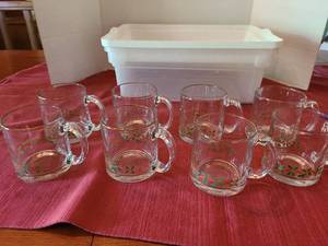 lot 1073 image: 8 Christmas mugs plus a storage tote