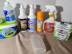 lot 2023 image: Household cleaning products and rodent repellent pouches.