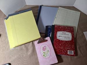 lot 2030 image: Writing pads, composition books, small clipboard