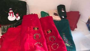 lot 3535 image: Christmas towels, pot holders and more in red storage bin