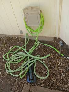 lot 4120 image: Garden Hose with Sprinkler