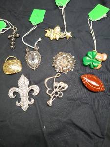 lot 16 image: Lot of 9 Pendants, Brooches, and Pins