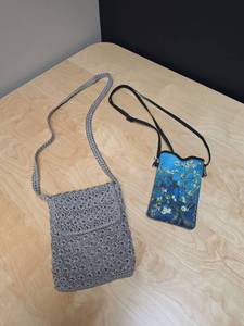 lot 54 image: Two small crossbody bags - one crochet purse and one fabric phone pouch