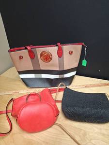 lot 57 image: One handbag and two crossbody purses