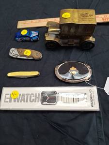 lot 63 image: 6 Various Collectibles First National Bank truck, die-cast car, knives, belt buckle, watchband