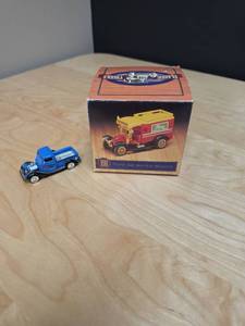 lot 75 image: Outdoor Life Diecast Truck and a boxed set of 4 vintage plastic toy trucks from Readers Digest