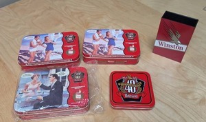 lot 79 image: Winston 40th Anniversary Commemorative Tins - three tins with playing cards inside, one empty tin and a cigarette box holder
