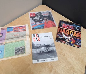 lot 83 image: NASCAR Ephemera lot - books, program, newspapers