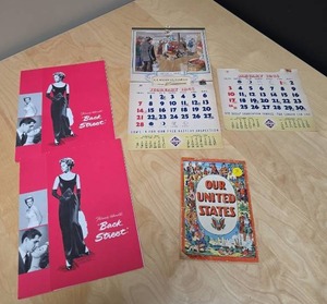 lot 86 image: Vintage Ephemera Lot - 2 Lobby Show Pamphlets, Vintage 1940s Calendars with cool photos, Our United States Comic Book