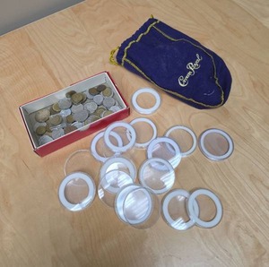 lot 87 image: Small box of foreign coins (lots of deutsch marks, some canadian) and a crown royal bag filled with coin protectors