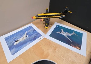lot 102 image: Aircraft Collection Beechcraft Die-Cast Model and Prints of Hawker 800XP and Raytheon Premier