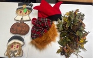 lot 206 image: Thanksgiving Themed Wood Wall Hanger, Fall Centerpiece, and two Halloween hats (a jester, and a scottish hat with hair)