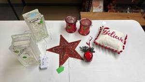 lot 229 image: Christmas Holiday Decoration Lot - two glass blocks with fairy lights, metal star, red candle buckets, Small hanging Believe pillow and a large red bell