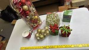 lot 240 image: Christmas Decoration Set -Red and Gold Ball Ornaments, Two Glittery Gift Box Shaped Ornaments, a mug and Christmas Lights