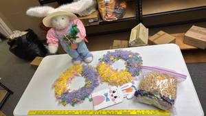 lot 245 image: Plush Bunny Rabbit holdig a carrot, tinsel wreaths, bunny shaped gift bag, and basket filler