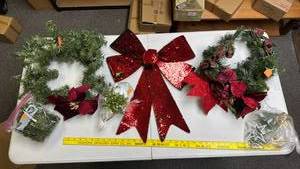 lot 248 image: Christmas Garland Wreaths with bows, large sequenced bow (red and green on reverse side), bag of small garland pieces, and some wreath pics