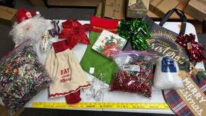 lot 249 image: Christmas Holiday Decoration Lot - wood sign, Eat and Be Merry Scarf, Bag of Tinsel Garland, Bead Garland, Gift Bag, Poinsettia wreath clips