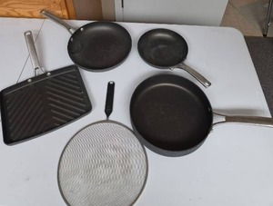 lot 806 image: Calphalon Skillets, Griddle Pan, and a Splater Guard