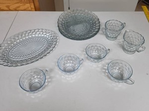 lot 829 image: Glass Dinnerware Set Bubble Pattern - has very faint light blue tint - oval serving tray, 3 divided plates, creamsugar set, and 4 tea cups