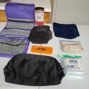 lot 870 image: Travel vanity bag w hanger, small travel bags, red cross emergency kit, bandages