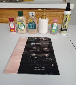 lot 880 image: Bath & Body Works Lotions and a heat tool pad