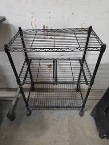 lot 306 image: 3-Tier Wire Shelving Unit with Casters Black - designed for middle shelf to hold baskets (no basekts included)  22 78 W x 12 78 D x 31.5 H