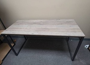 lot 311 image: Gray Wood laminate table with black metal base (see desc).  Some corner finish wear.  55W x 23 58 D x 29 38 H