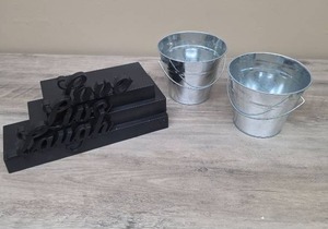 lot 352 image: Black Tiered Floating Shelving with Live Love Laugh accents and 2 small metal buckets