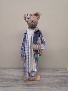 lot 367 image: Country themed Stuffed Teddy Bear with Plaid Dress and Accessories on wood base.