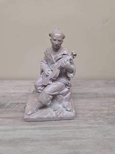 lot 385 image: Glazed Concrete Asian Man Figurine playing string instrument