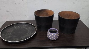 lot 412 image: Ceramic plant tray, 2 black clay planters and a small purple planter with white polka dots