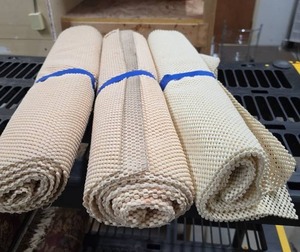 lot 420 image: Three under rug non-slip pads of various sizes.