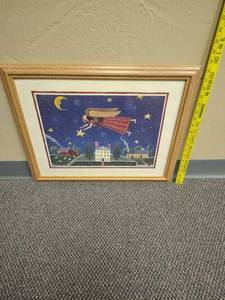 lot 438 image: Framed Print Angel Flying Over Houses Night Sky Moon Stars - approx 22 W x 18.5 H