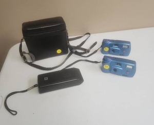 lot 543 image: Two one time use 35mm cameras, small black camera and camera bag