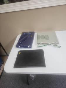 lot 553 image: 2 brand new Amazon Basics 3-ring binders, faux leather portfolio and an American Express Clip Board with storage