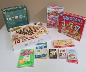 lot 580 image: Games & Puzzles Lot Outburst, 10-Game Set, Hedban�, Greedy Grams, Sudoku, More