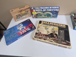 lot 584 image: Lot of 4 Board Games Exiled, Wheel of Fortune, Secret Weapon, Billionaire