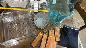 lot 640 image: Round plastic tub and storage tote, Cedar Closet Blocks, expandable storage tray, and a hangable bag filled with clothes pins