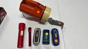 lot 686 image: Flashlights including a Coleman lantern and a large and small red Maglite
