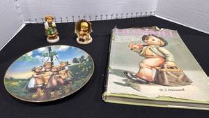 lot 1055 image: M.I. Hummel Club 3 inches figurine My Lucky Heart Goebel Hummel Figurine #2298, plate and Hummel collector guide book with figurine