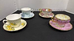 lot 1057 image: Decorative cups and saucers set of 4
