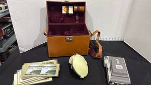 lot 1094 image: Vintage 1950s Polaroid Land Camera Model 80 compact folding bellows camera, case, flash and stereoscope cards