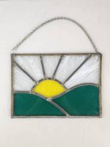 lot 45 image: Vintage Stained Glass Sun and Landscape Panel with Chain Hanger 10x7.5