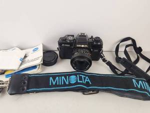 lot 53 image: Minolta X-700 SLR Camera with 50mm Lens, Strap and Manuals