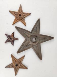 lot 214 image: Cast Iron Vintage Metal Star Wall Plaques with Center Hole Mixed Sizes Lot of 4