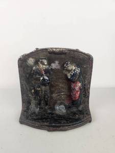lot 219 image: Cast iron Relief Plaque with Two Figures Doorstop