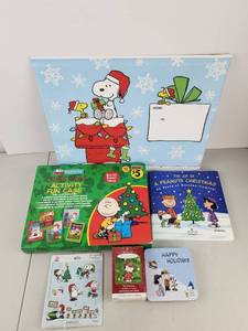 lot 555 image: Peanuts Christmas Bundle Gift Bag Activity Fun Case Book Ornament Stickers