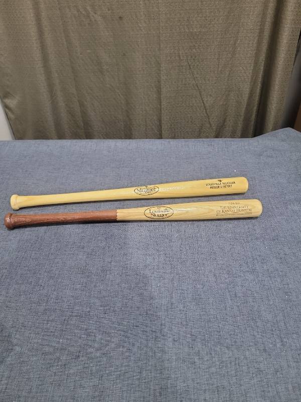 lot 339 image: Louisville Slugger Baseball Bats 2-Piece Lot Museum Factory University of Kansas Hospital