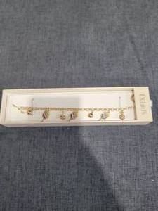 lot 779 image: Dillards Charm Bracelet with Multicolor Enamel Charms Gold Tone